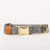 Dog collar with herringbone pattern, brown leather strap, and gold buckle on a white background