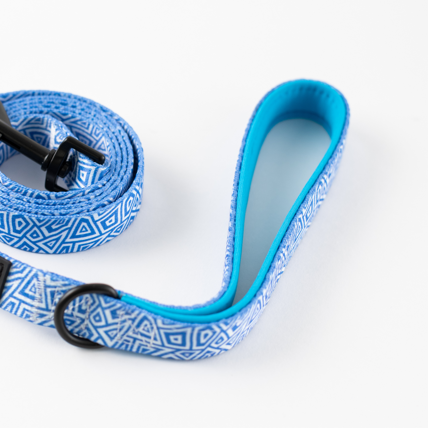 Little Pickle blue geometric patterned dog leash with padded handle and black hardware on white background